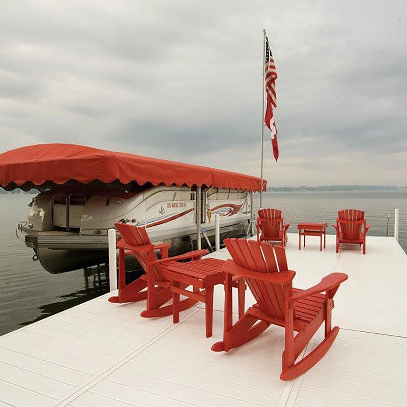 Waterfront dock with red Adirondack chairs